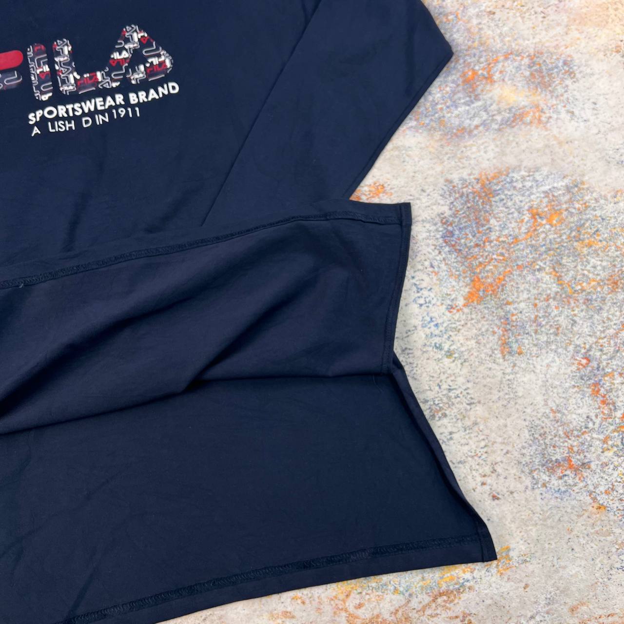 تیشرت آستین بلند نخی برند FILA سایز XS | استوک اورجینال – استوک مارک باز